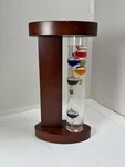 Acu Rite Galileo Thermometer With Wood Stand Floating Bulb Glass 9". Fixed Price $14.99.