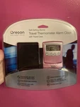 New Pink Oregon Scientific Self-setting Atomic Travel Thermometer Alarm Clock. Fixed Price $37.99.