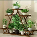 Multi Tier Wooden Plant Stand Carbonized Flower Rack Potted Organizer Wheeled. Fixed Price $37.95.