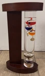 Acu Rite Galileo Thermometer With Wood Stand Floating Bulb Glass 9". Fixed Price $14.99.