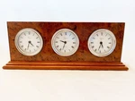 World Clock Burr Yew Wood With Sterling Silver Bezels, New York, London, Tokyo. Fixed Price $390.51.