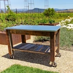 Redwood Rolling Cart Swivel Cast Iron Wheels Brakes Outdoor Garden Work Bench. Fixed Price $1499.99.