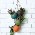 Dangling Southwest Desert Color Ceramic 4 Pot Set Wall Mount Flower Planters. Fixed Price $32.99.